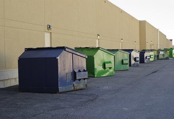 metal waste containers sit at a busy construction site in Bristol, RI